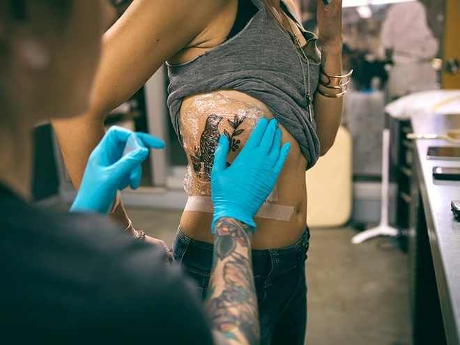 A protective film is an extremely useful item to protect tattoos when commuting outdoors.