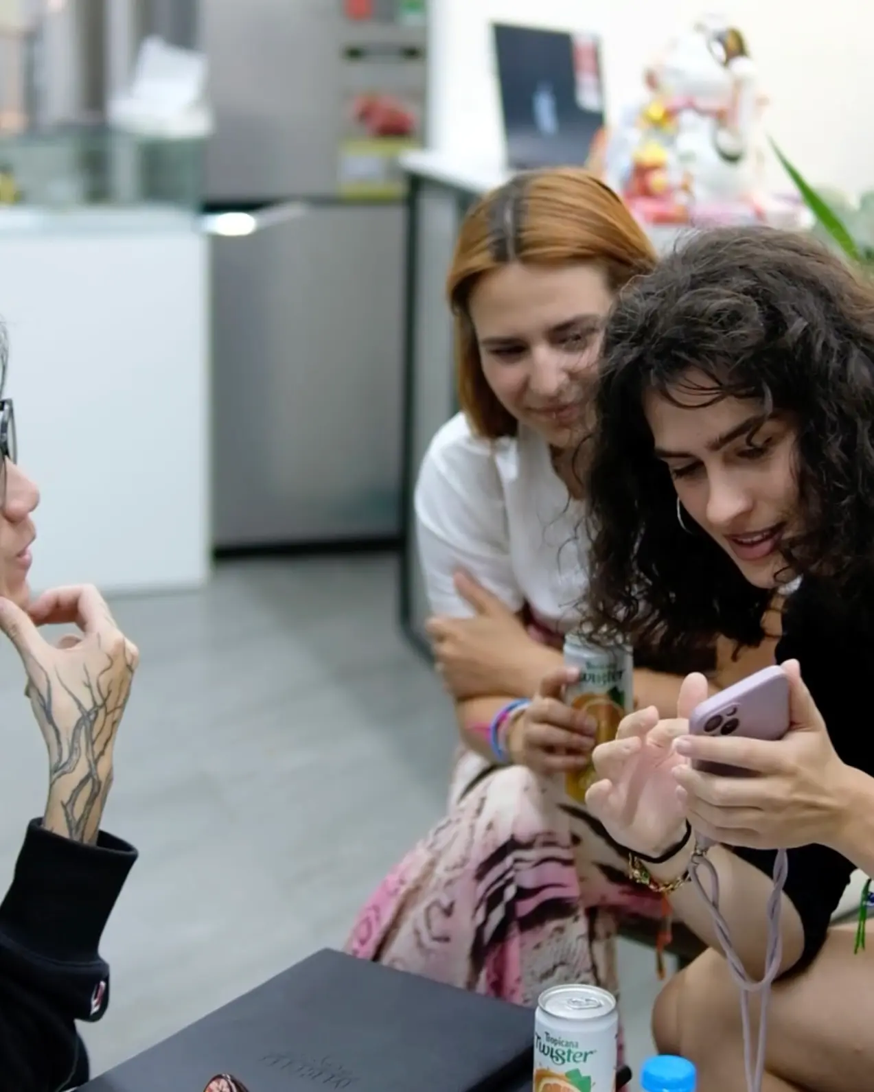 A foreign customer receiving professional tattoo design consultation at H2M Tattoo Studio in Hanoi