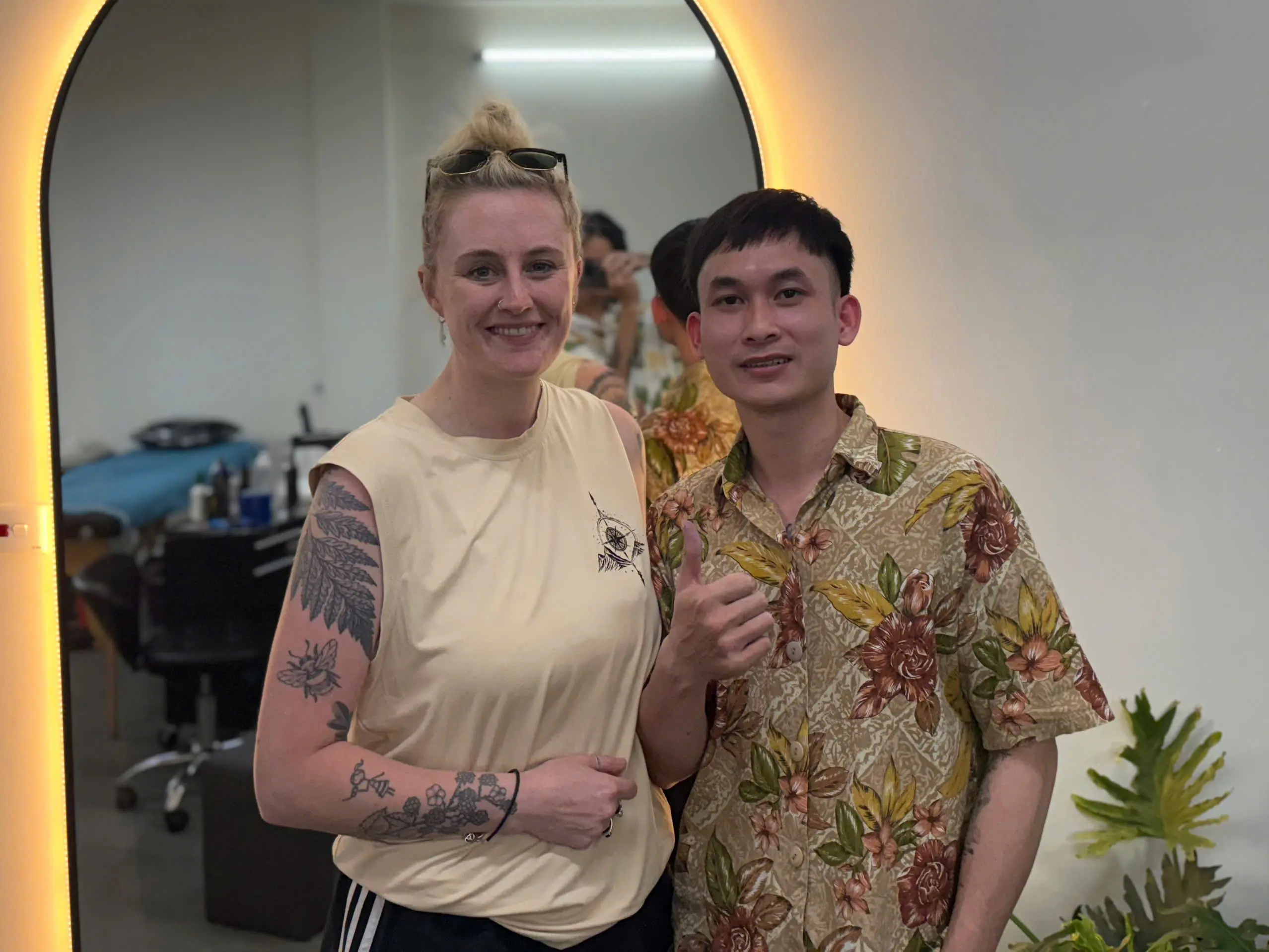 Foreigner smiling after tattoo session at H2M Tattoo Studio in Hanoi