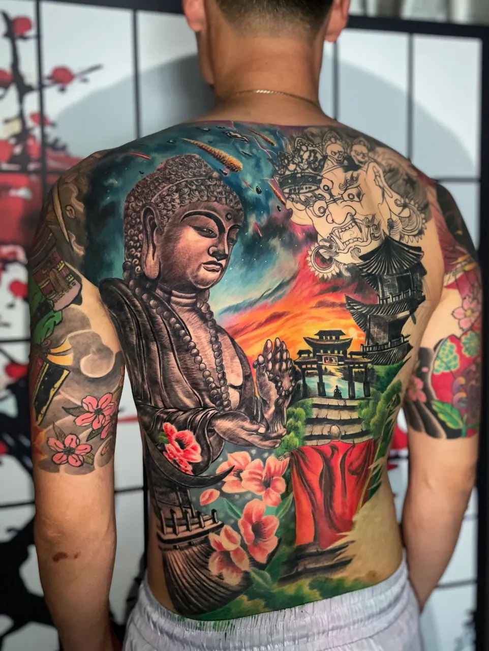 Full back traditional Japanese tattoo of devil and Buddha