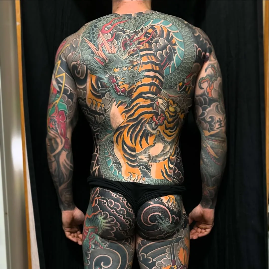 Full back traditional Japanese tattoo with dragon and tiger