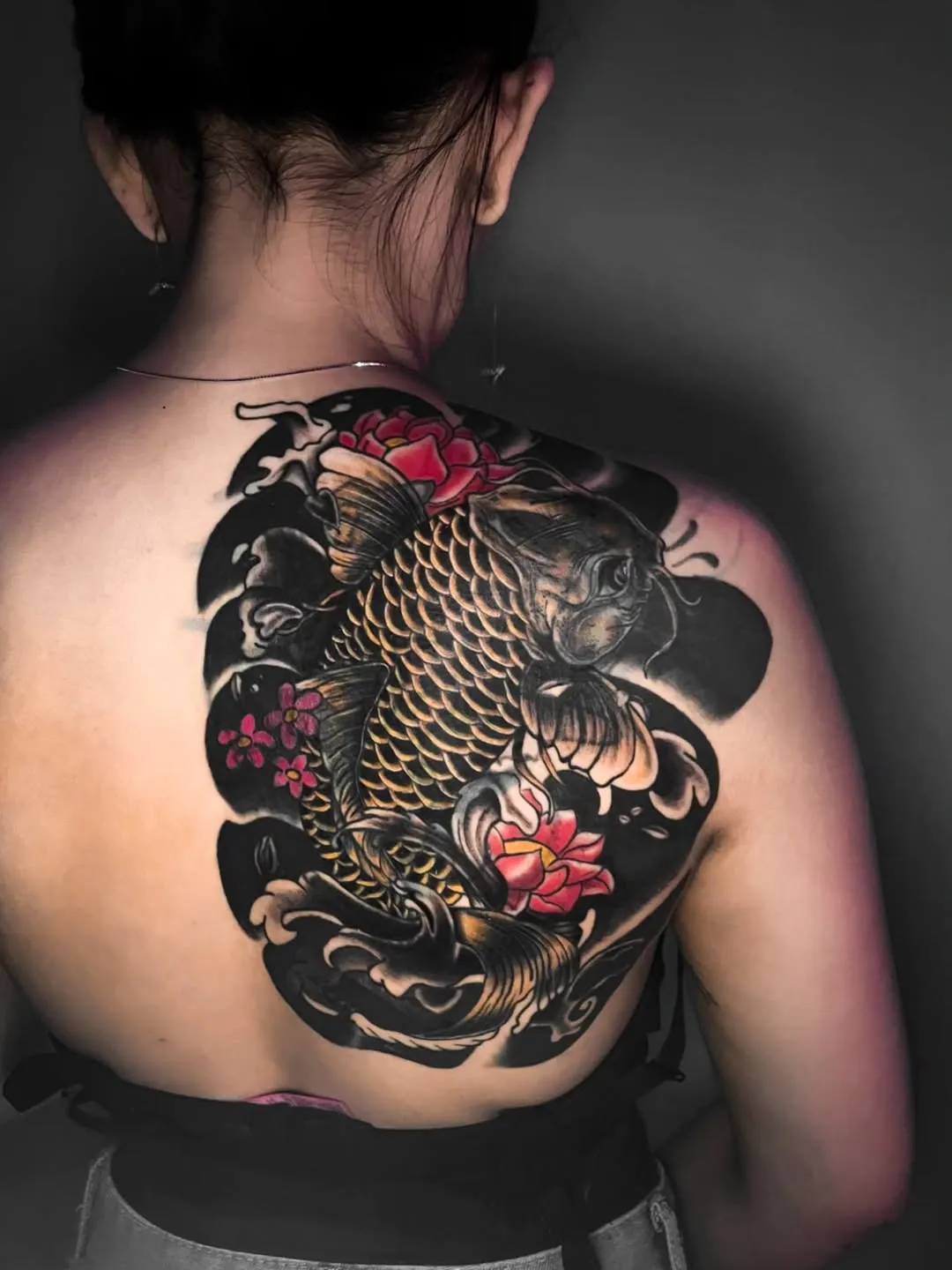 Half back Japanese tattoo with Koi fish