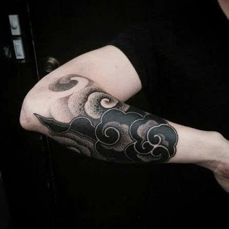Cloud tattoo on hand