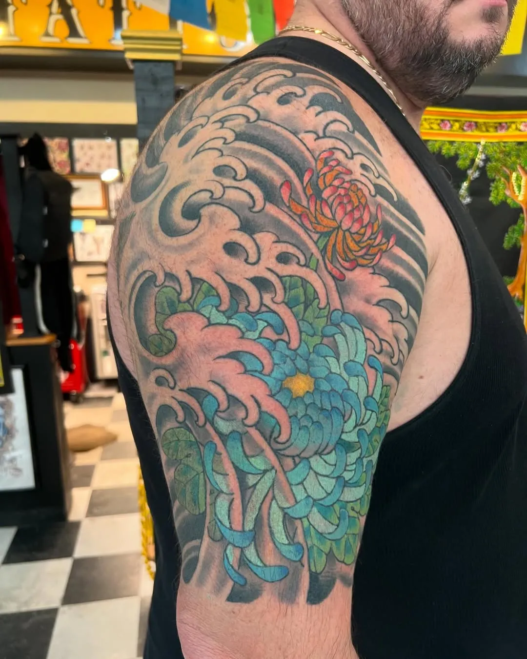 Peony Power in Traditional Japanese Bicep Tattoo
