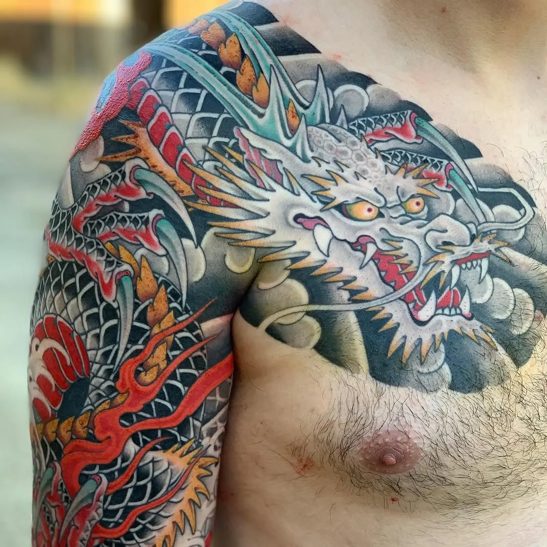 Traditional Japanese Bicep Tattoo with dragon and waves