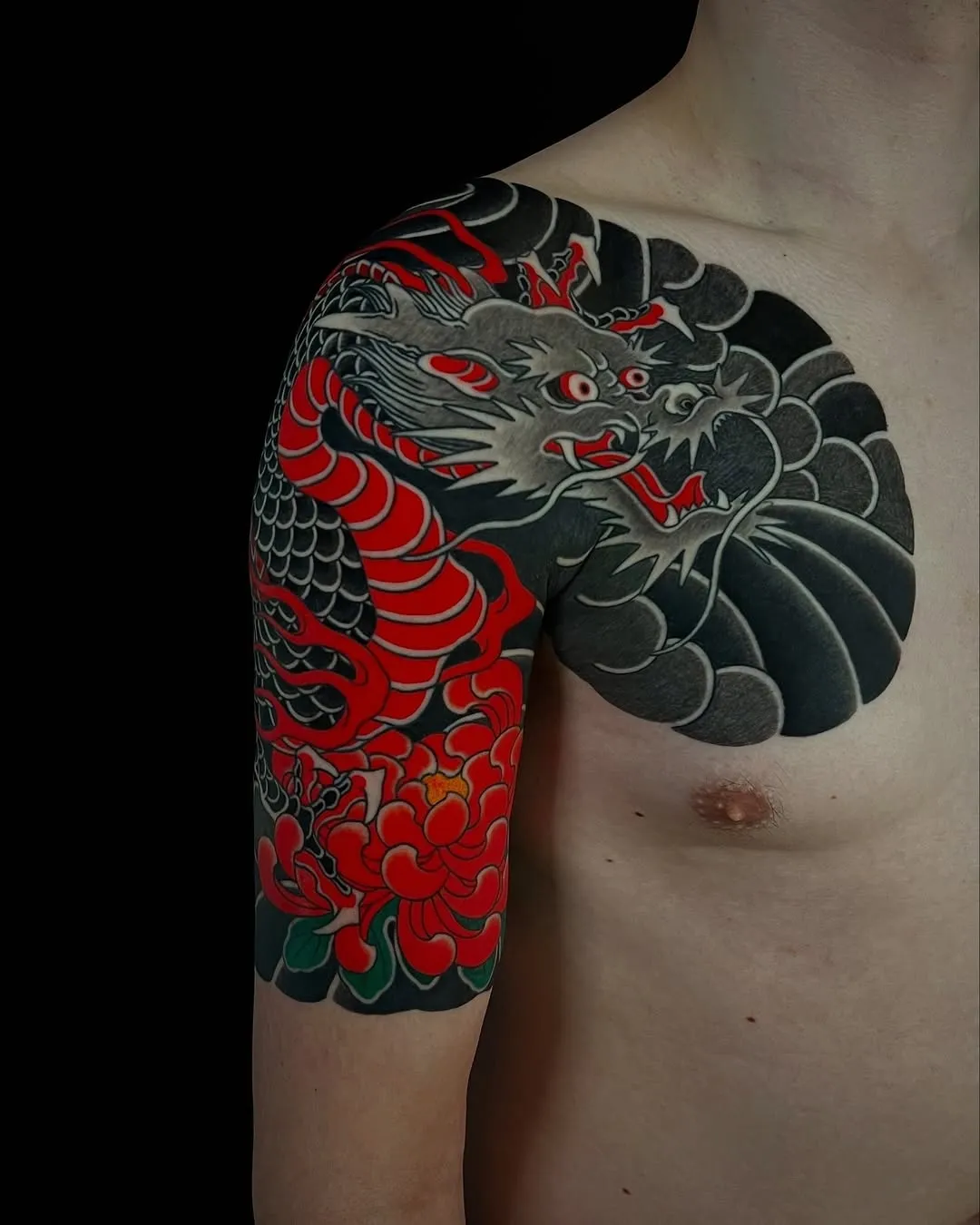Traditional Japanese Bicep Tattoo featuring dragon spirit