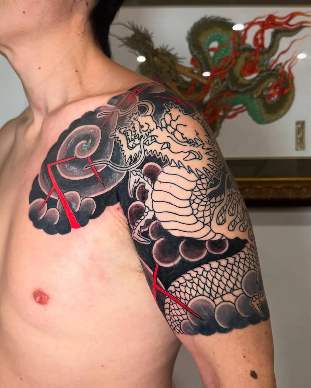 Traditional Japanese Bicep Tattoo of a flying dragon
