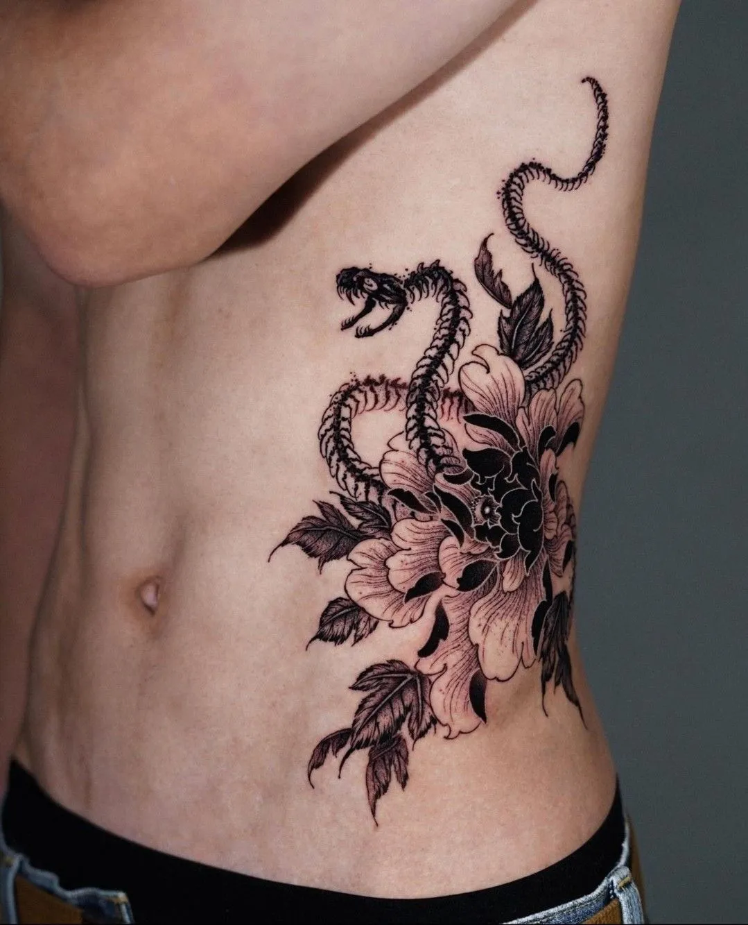 This ornamental floral work is meticulously placed to highlight and flatter the body&rsquo;s unique silhouette.