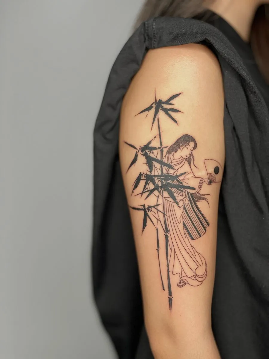 Vietnamese women tattoo combined with bamboo