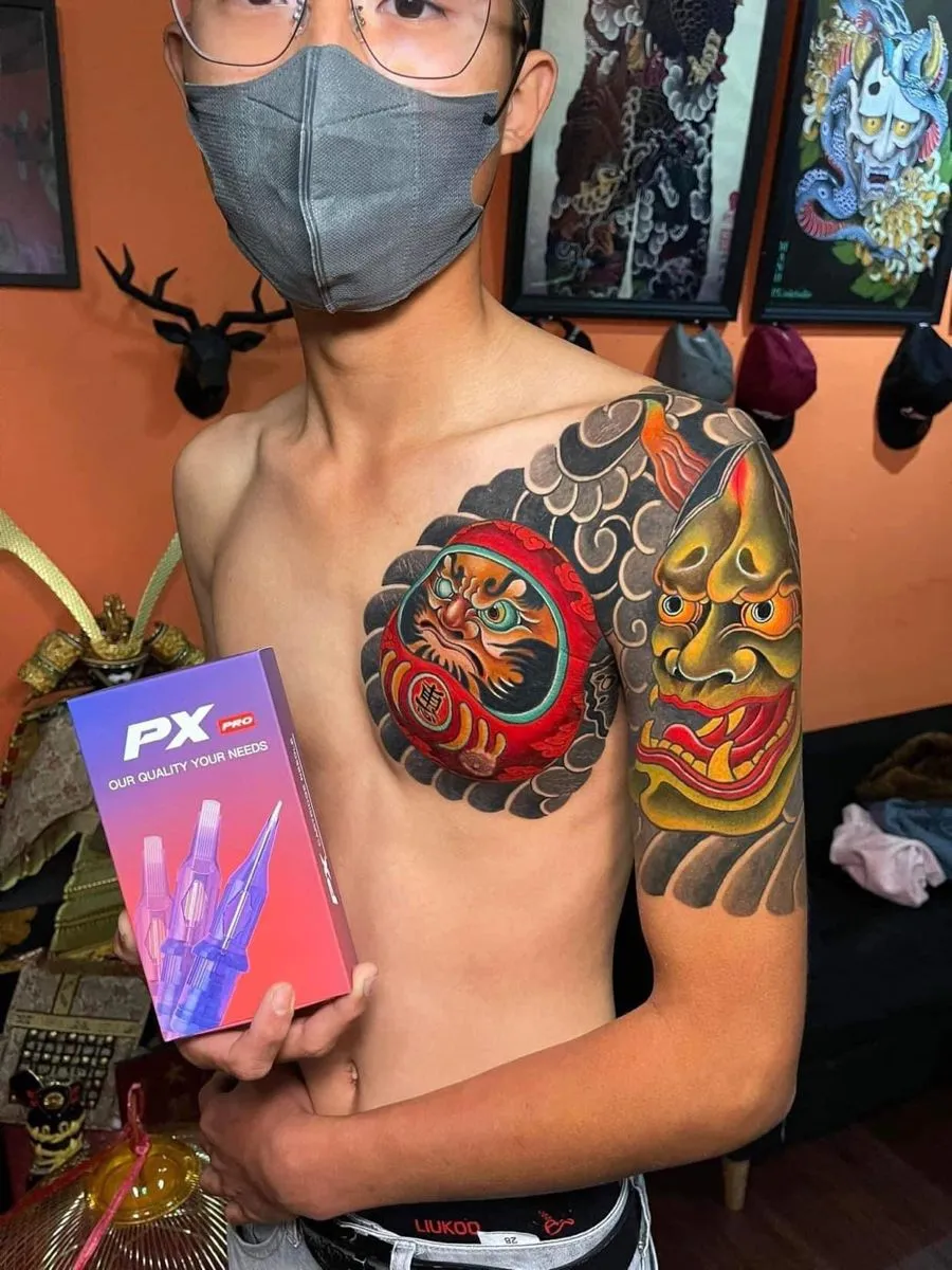 demon face tattoo on hand