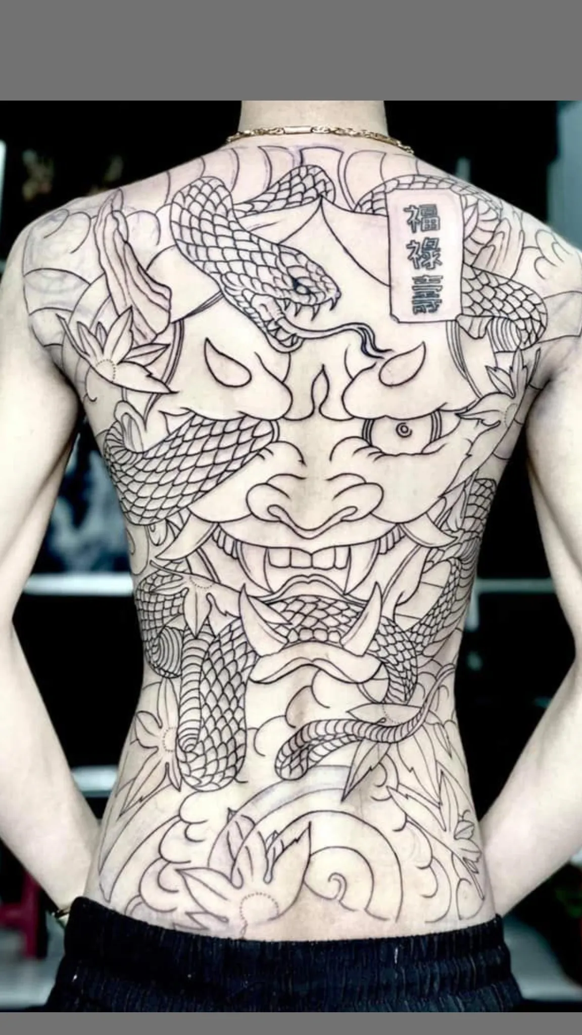 full back demon face tattoo