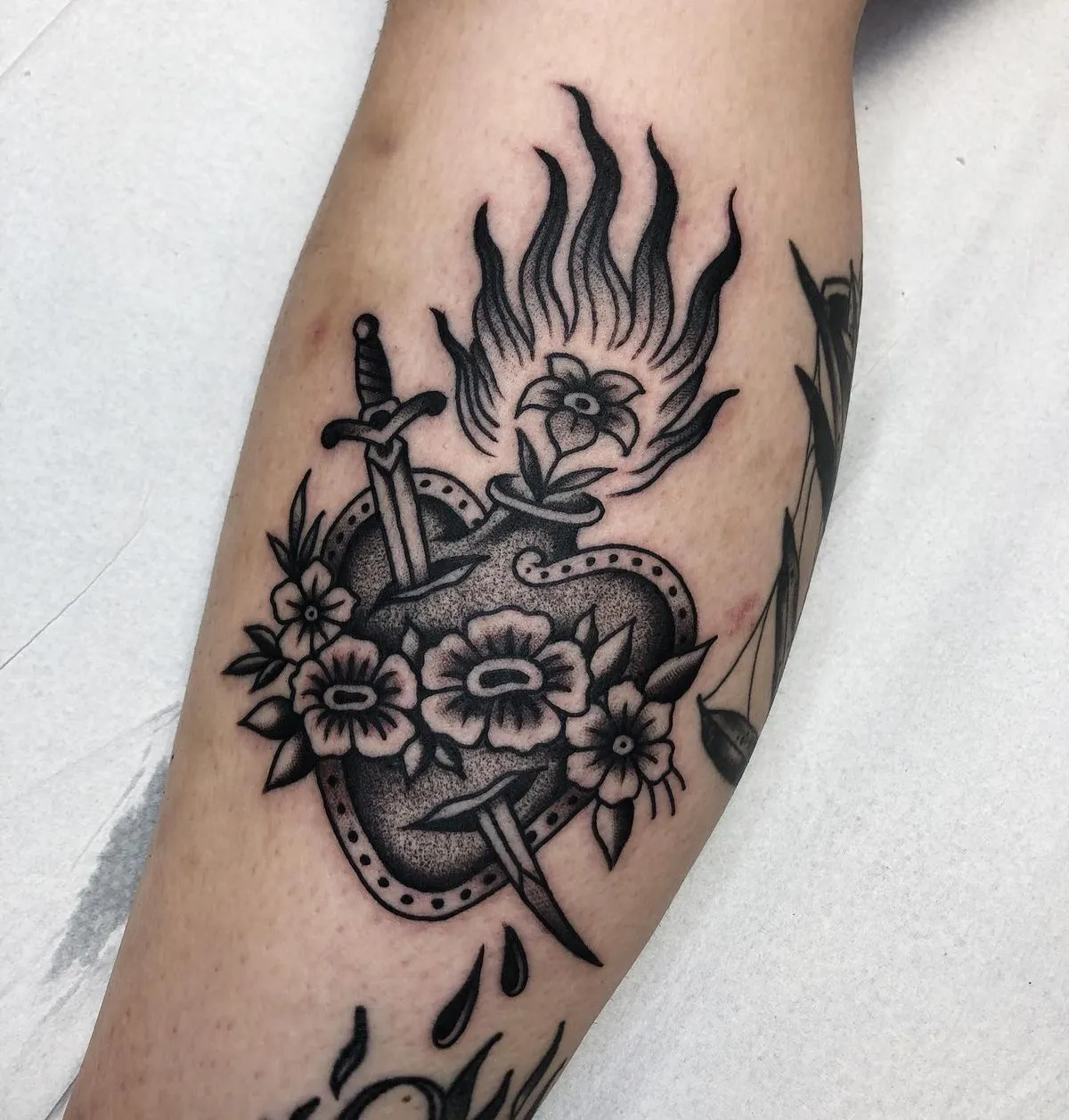 Old school black heart tattoo