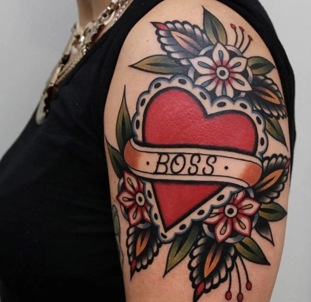 Old school heart tattoo on bicep