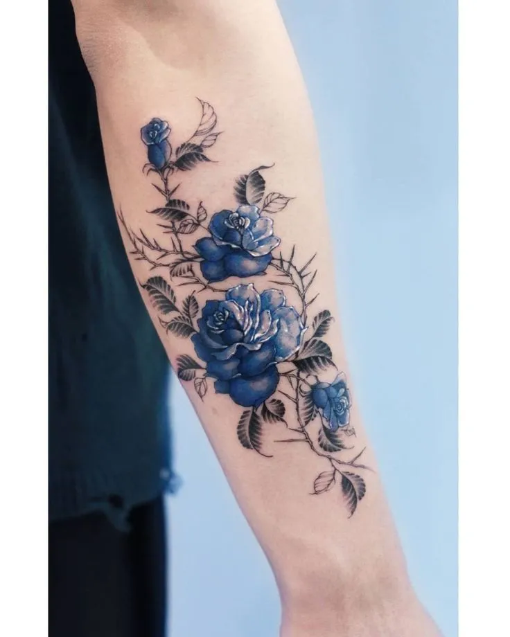 Old school blue rose tattoo
