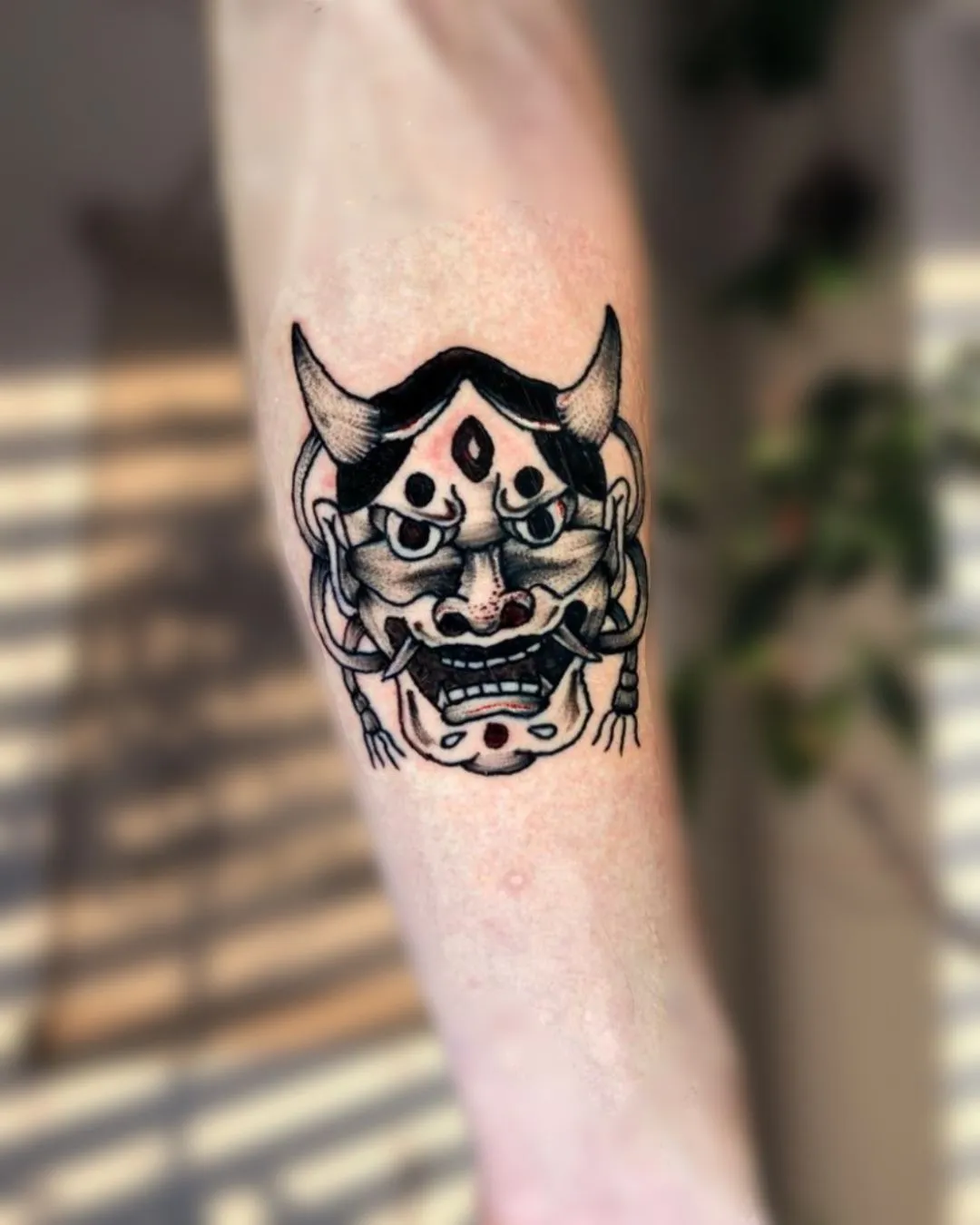 Top 15+ Demon Face Tattoo Designs on Hand: Powerful and Refined Symbols of Protection