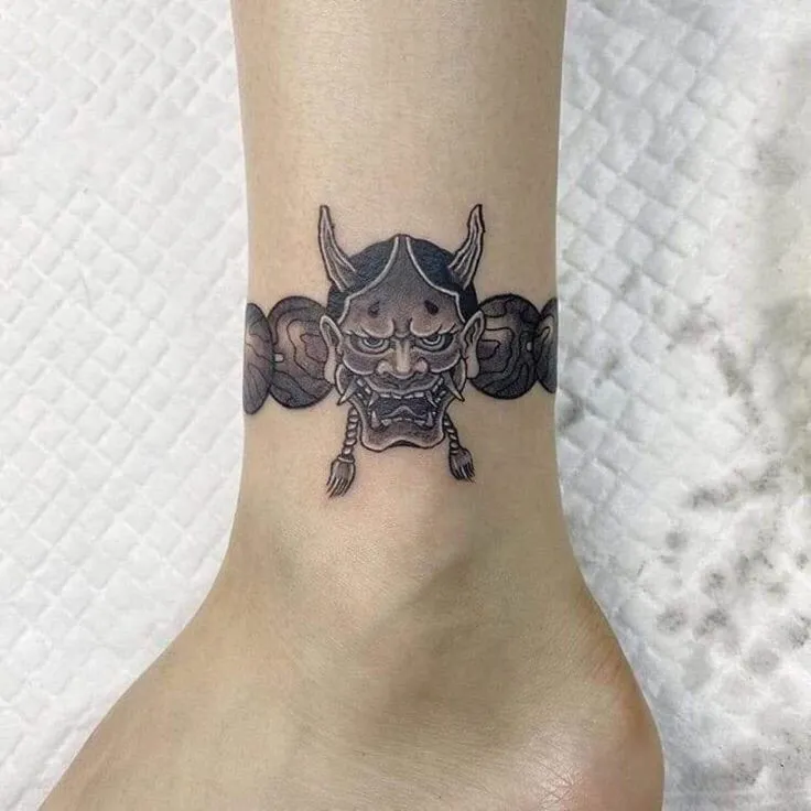 Top 20+ Mini Demon Face Tattoo Designs: Subtle Protective Symbols and Embrace of Feminine Strength