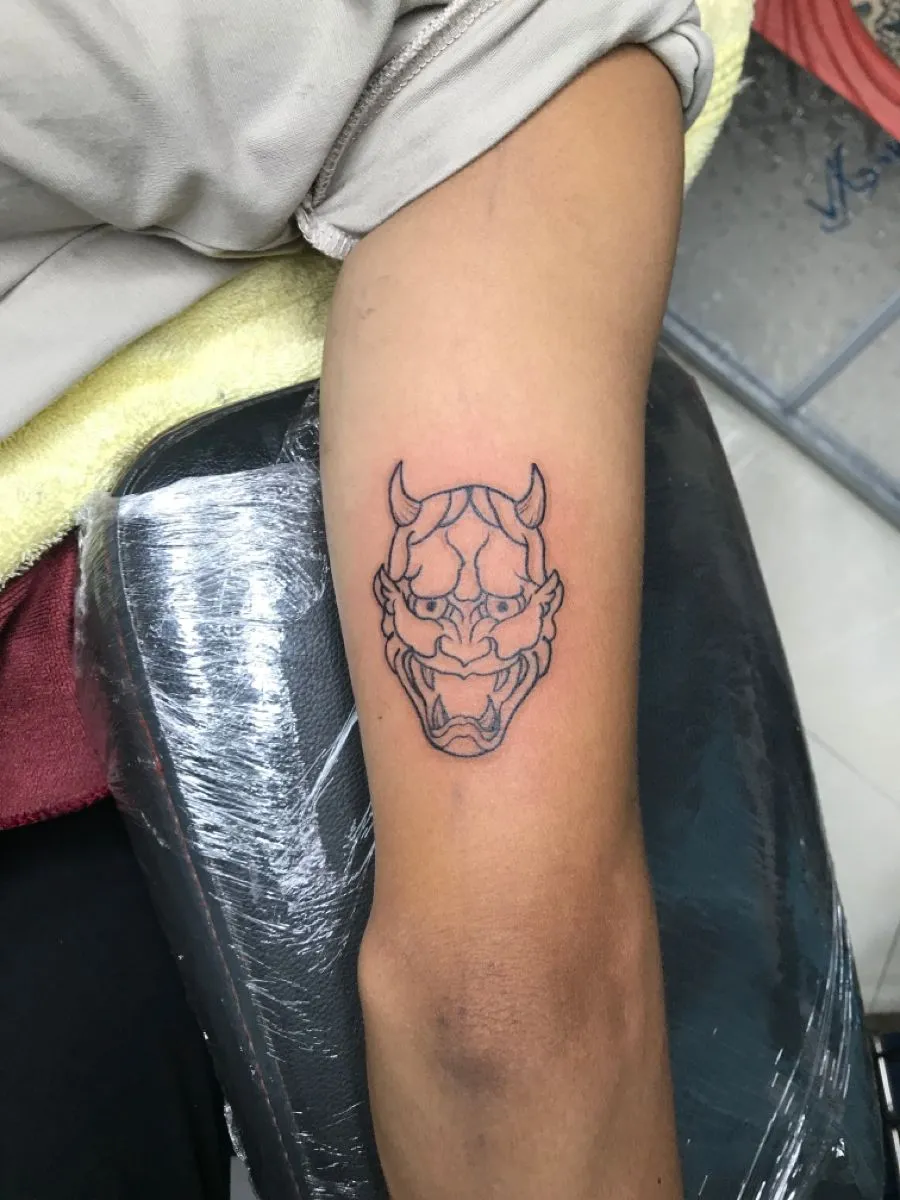 Top 20+ Mini Demon Face Tattoo Designs: Subtle Protective Symbols and Embrace of Feminine Strength